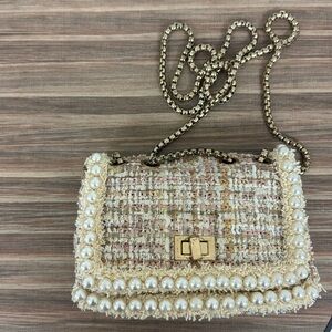 Cute designer-inspired pink and cream crossbody!